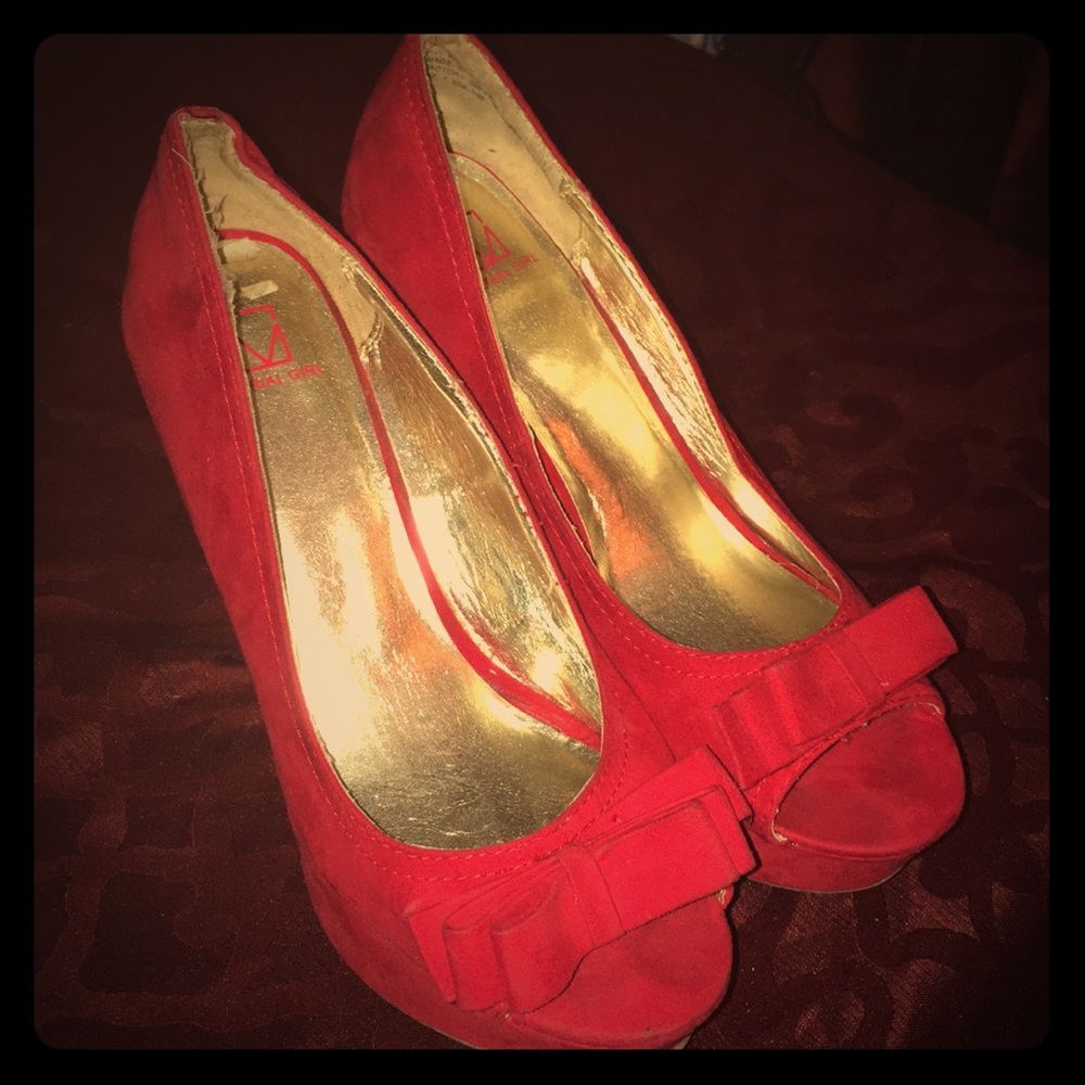 Red wedge heels.